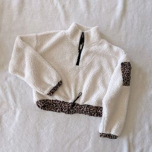 Cropped cheetah print quarter zip sweater